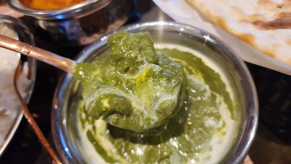 A bowl of palak paneer curry