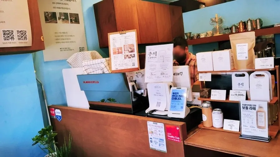 Sign noting canned coffee is available