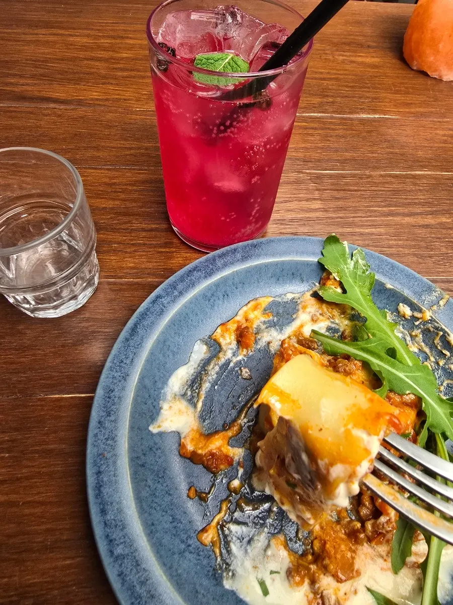 Fresh lasagna topped with cheese at Concasse Anguk