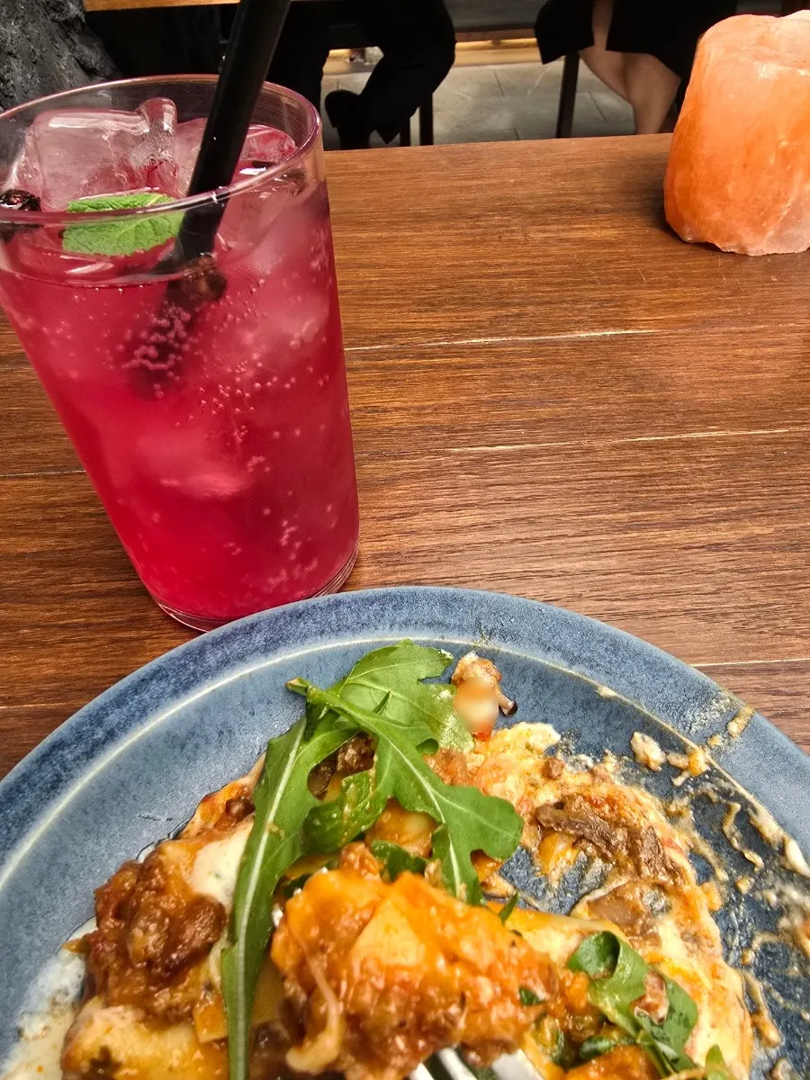 A glass of reddish iced omija tea