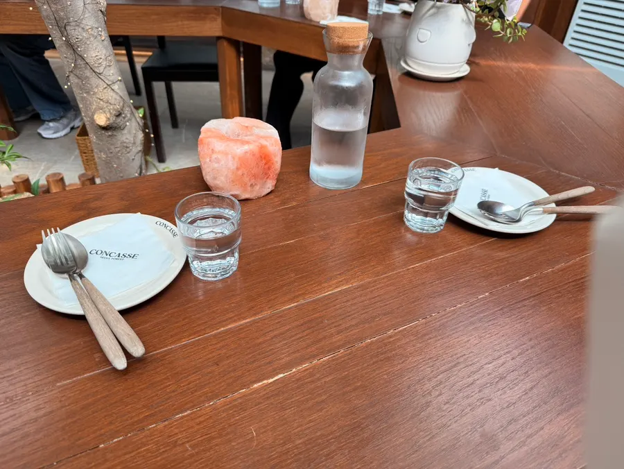 Courtyard bar seats with natural light at Concasse Anguk