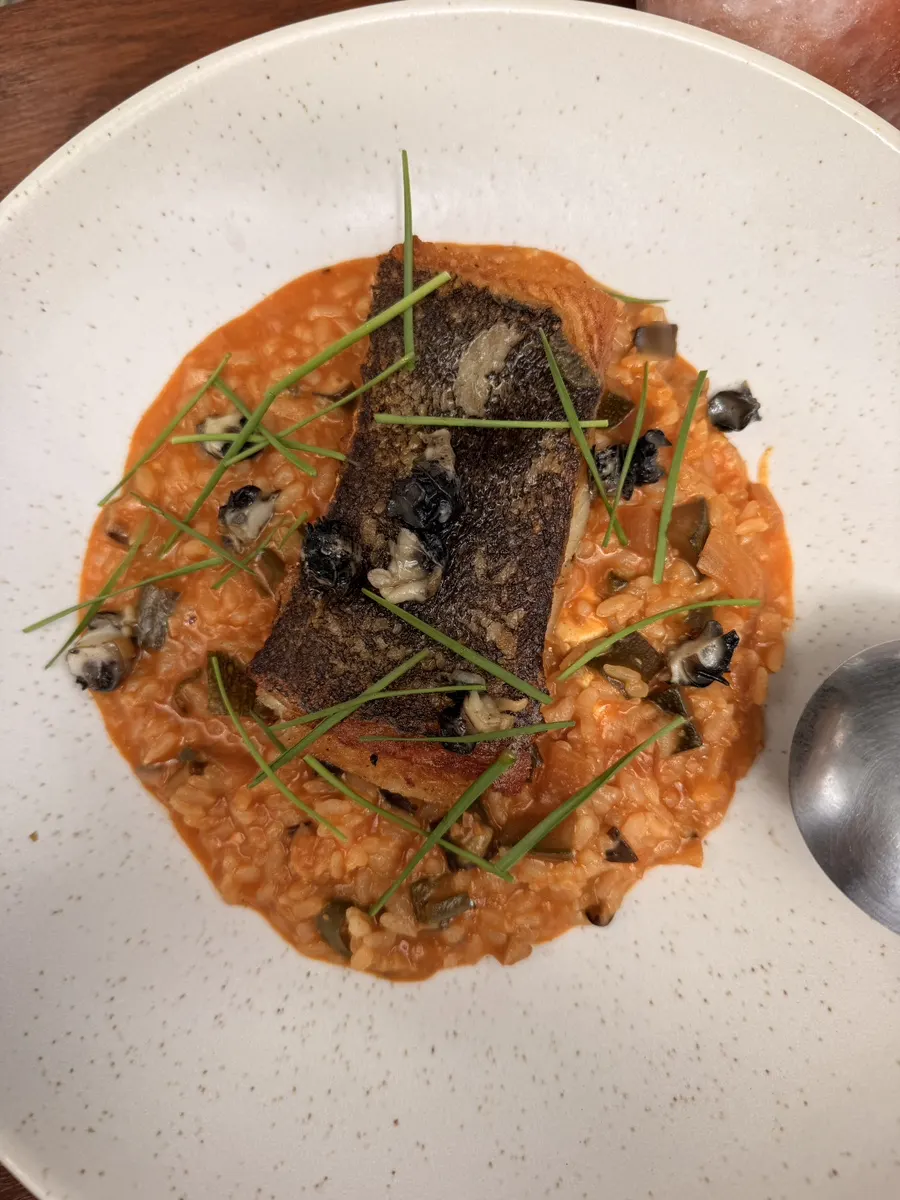 Plating of flounder steak with doenjang risotto at Concasse Anguk