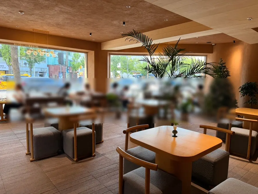Wood-toned interior seating at CORR