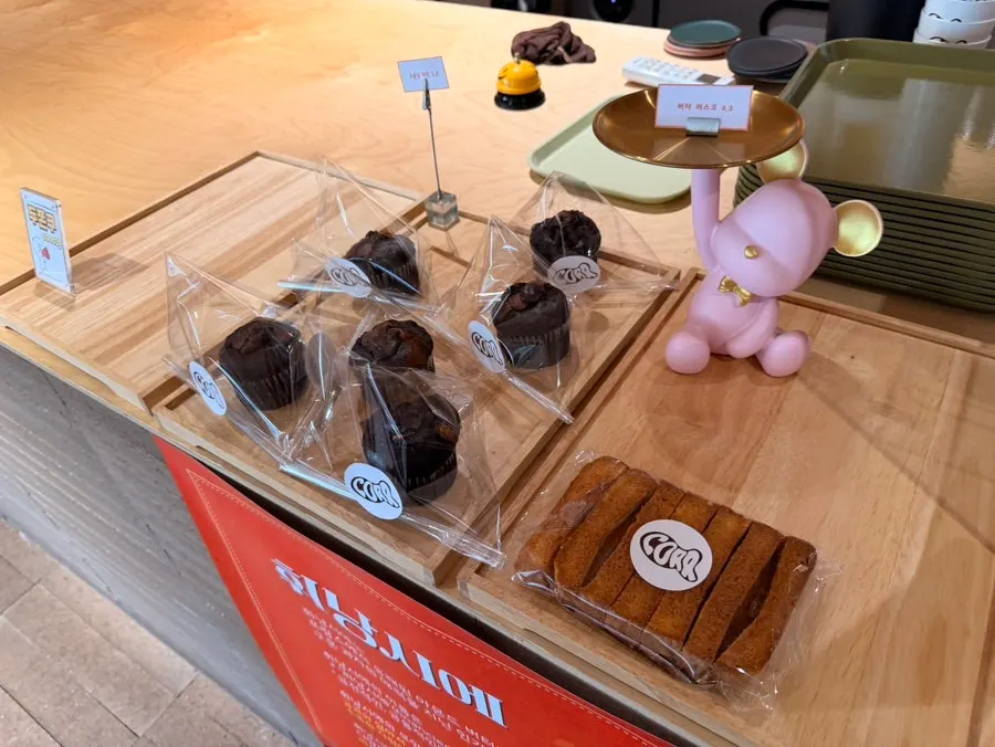Order counter with dessert showcase at CORR