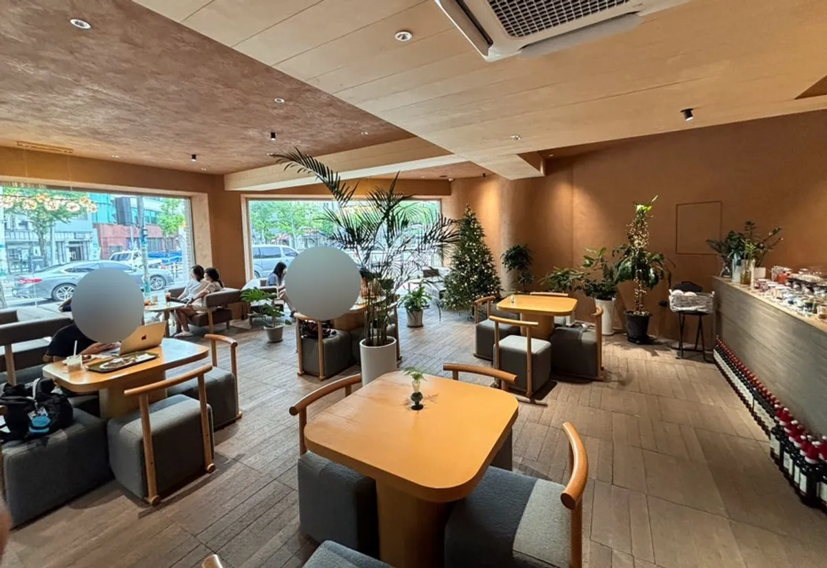 Interior of CORR with wood tones and full windows