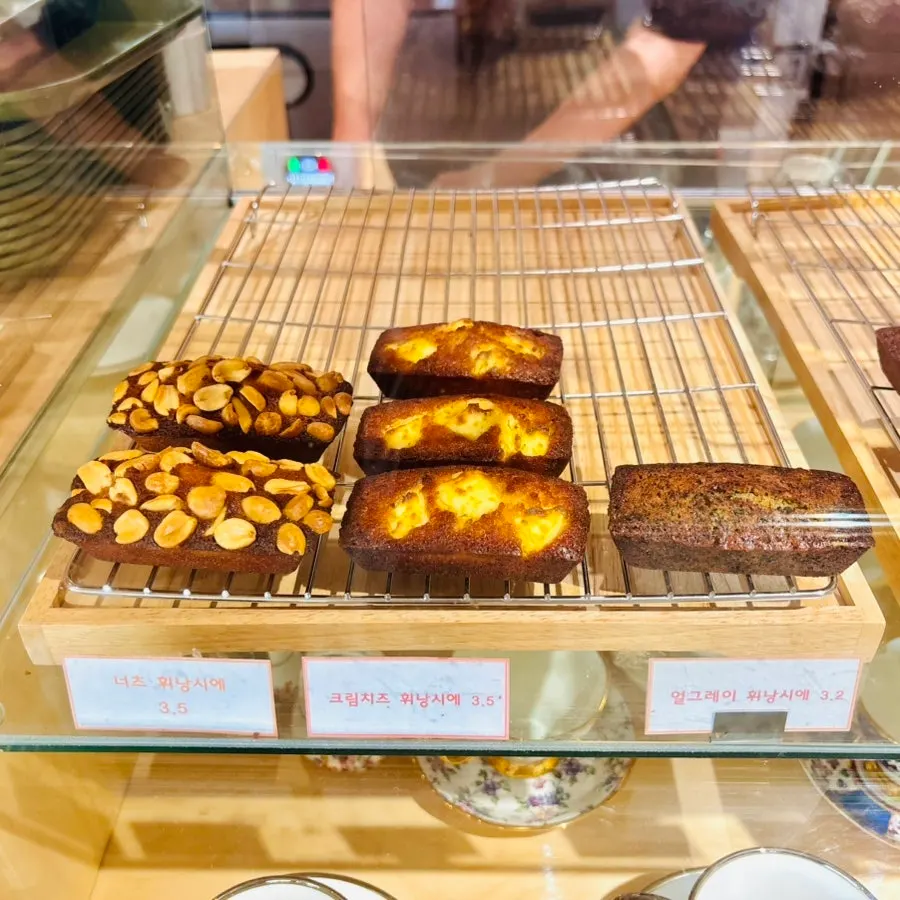 A display case with over 10 kinds of financiers