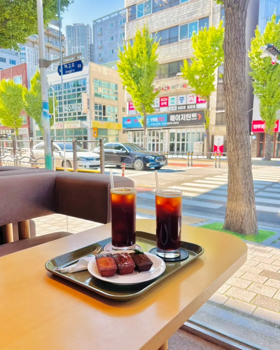 Table with coffee and three kinds of financiers