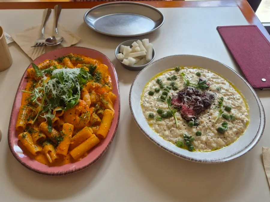 A table set with pasta and risotto together