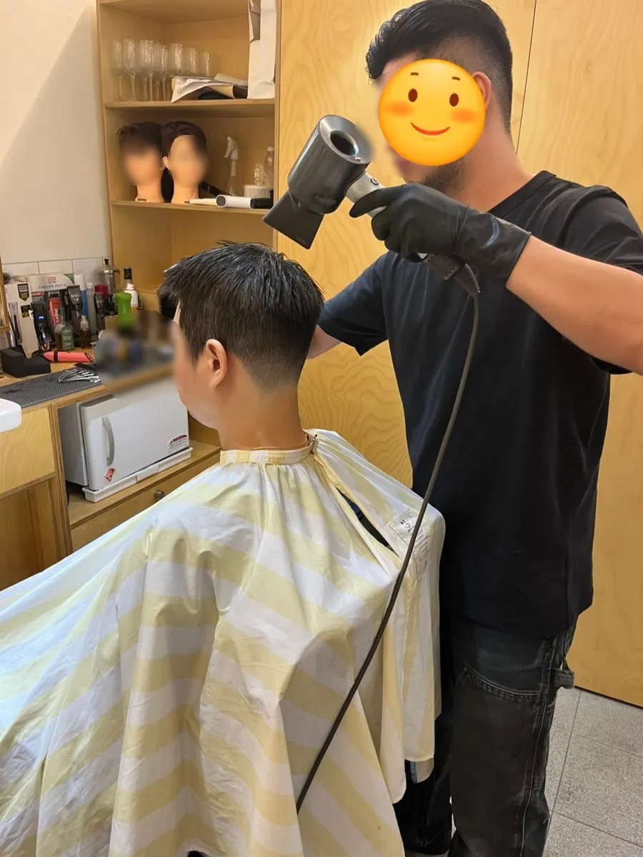 Shaping the hair with a hairdryer during finishing