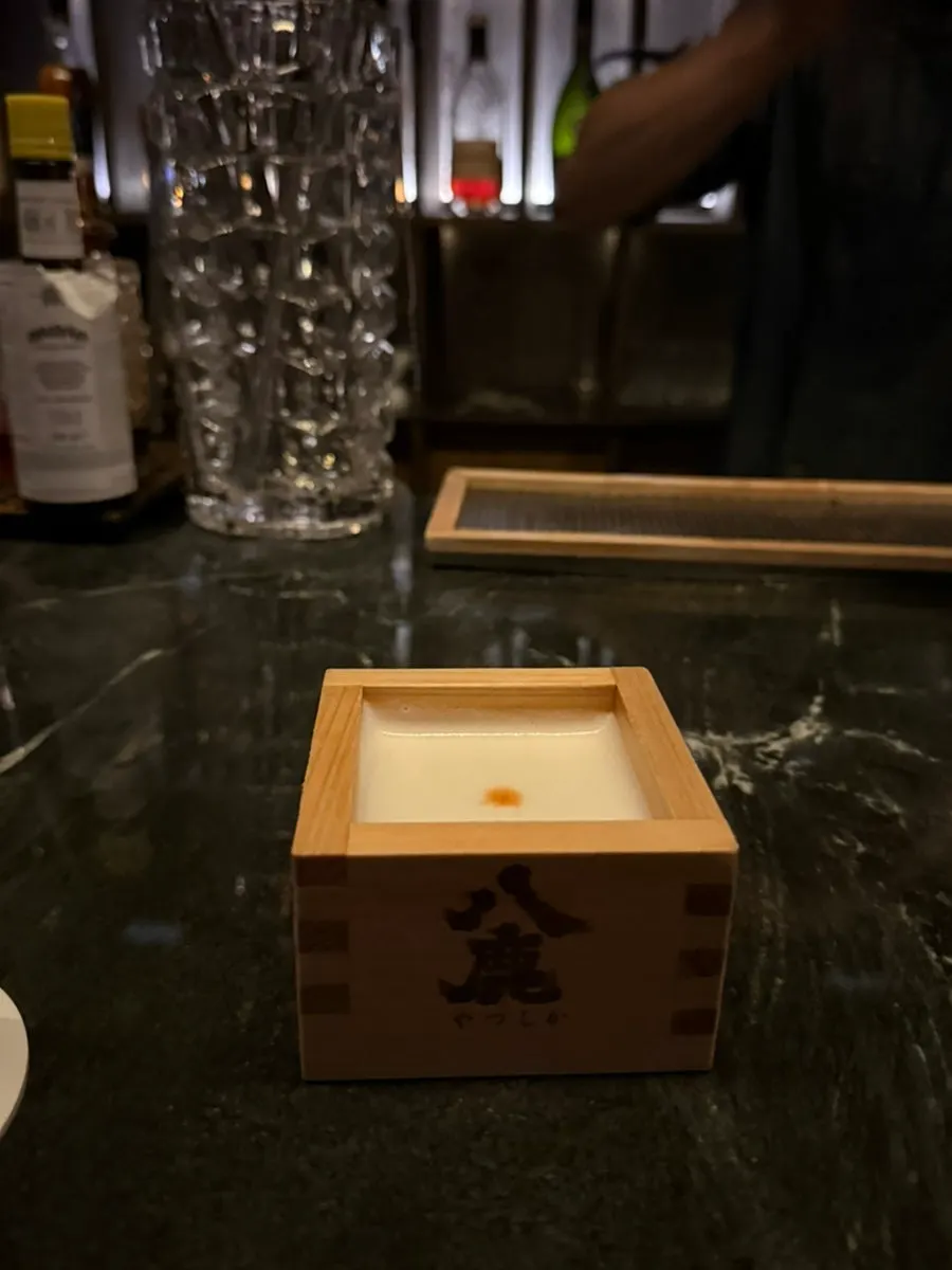 Glass of the signature TWG Sour cocktail