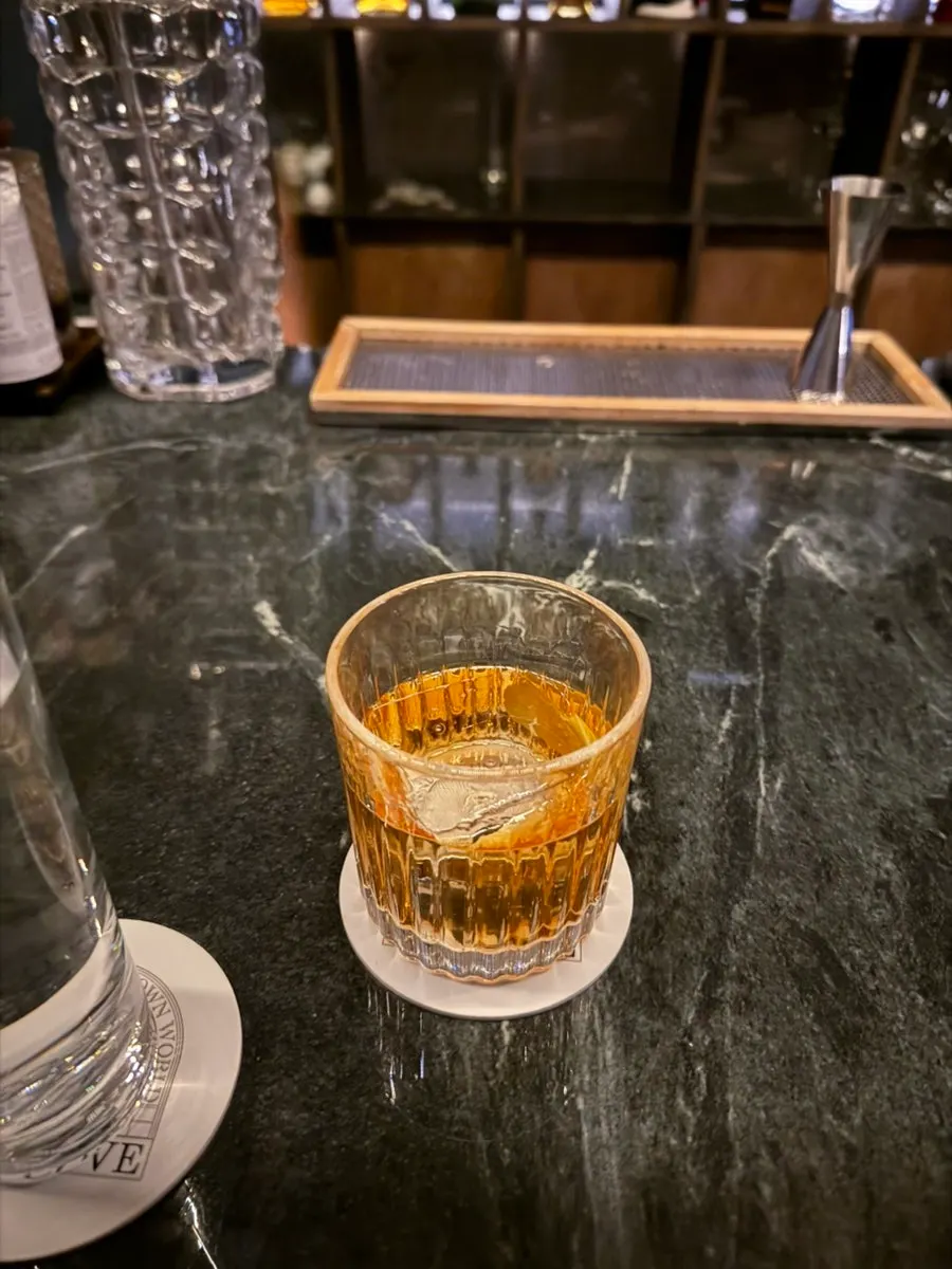 Two cocktails placed on the bar table