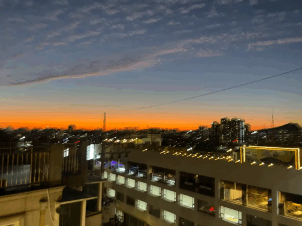 Sunset view from Cove Bar, a rooftop cocktail bar in Haebangchon