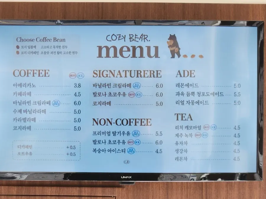 Cozy Bear drink menu board with prices