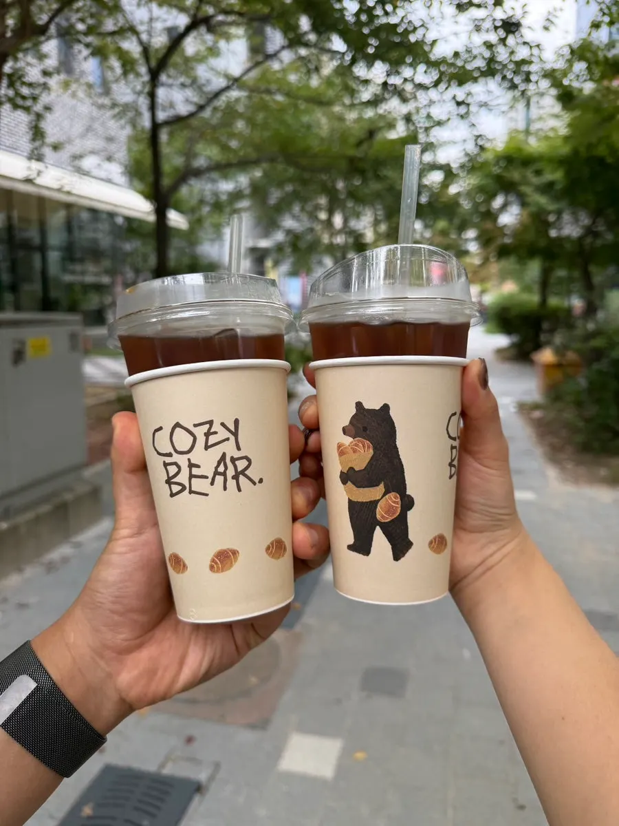 Bear-illustrated cup sleeve with packed salt bread