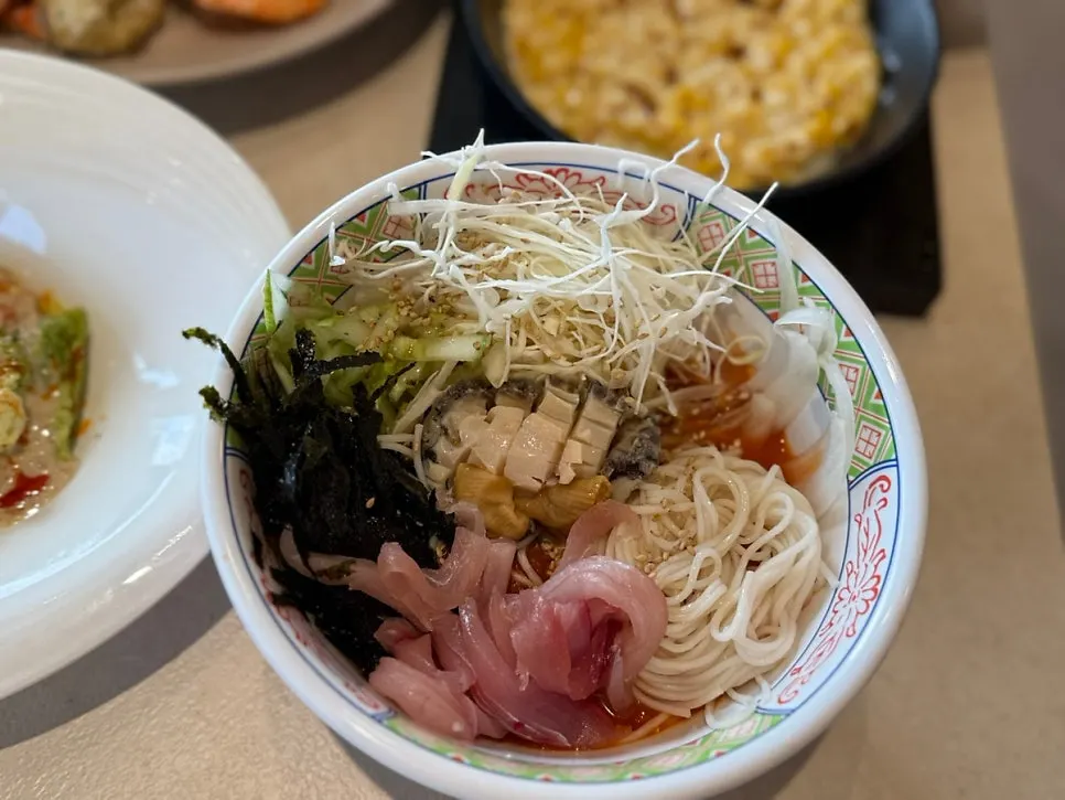 A bowl of mulhoe packed generously with raw fish