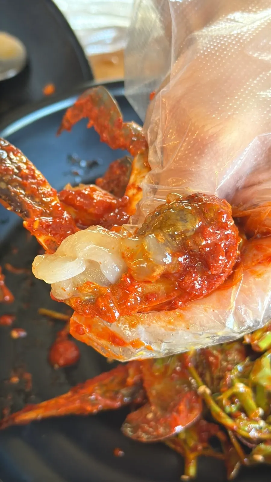 Picking up a piece of spicy crab