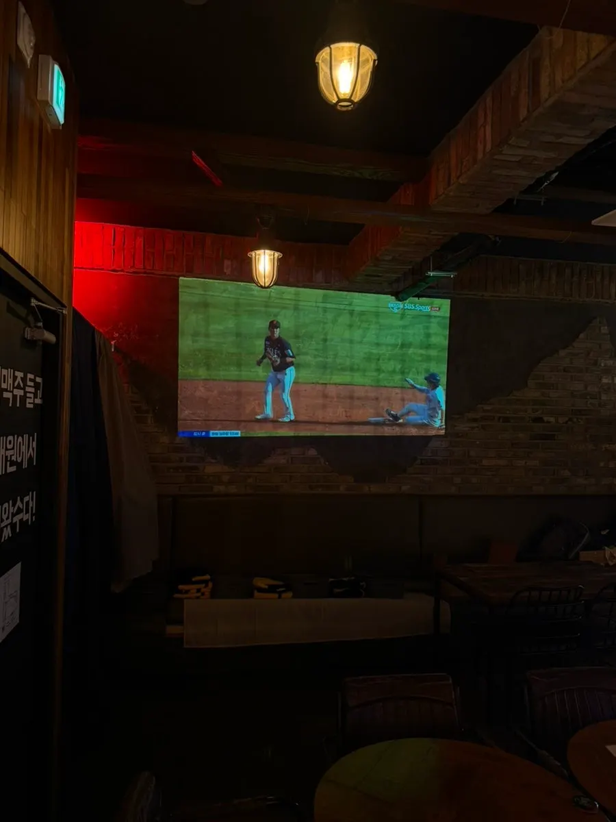 Seating area with large screen for watching sports