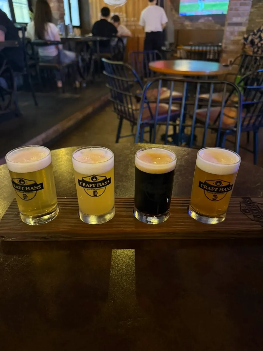 Four-beer sampler: pilsner, weizen, dark ale, pale ale