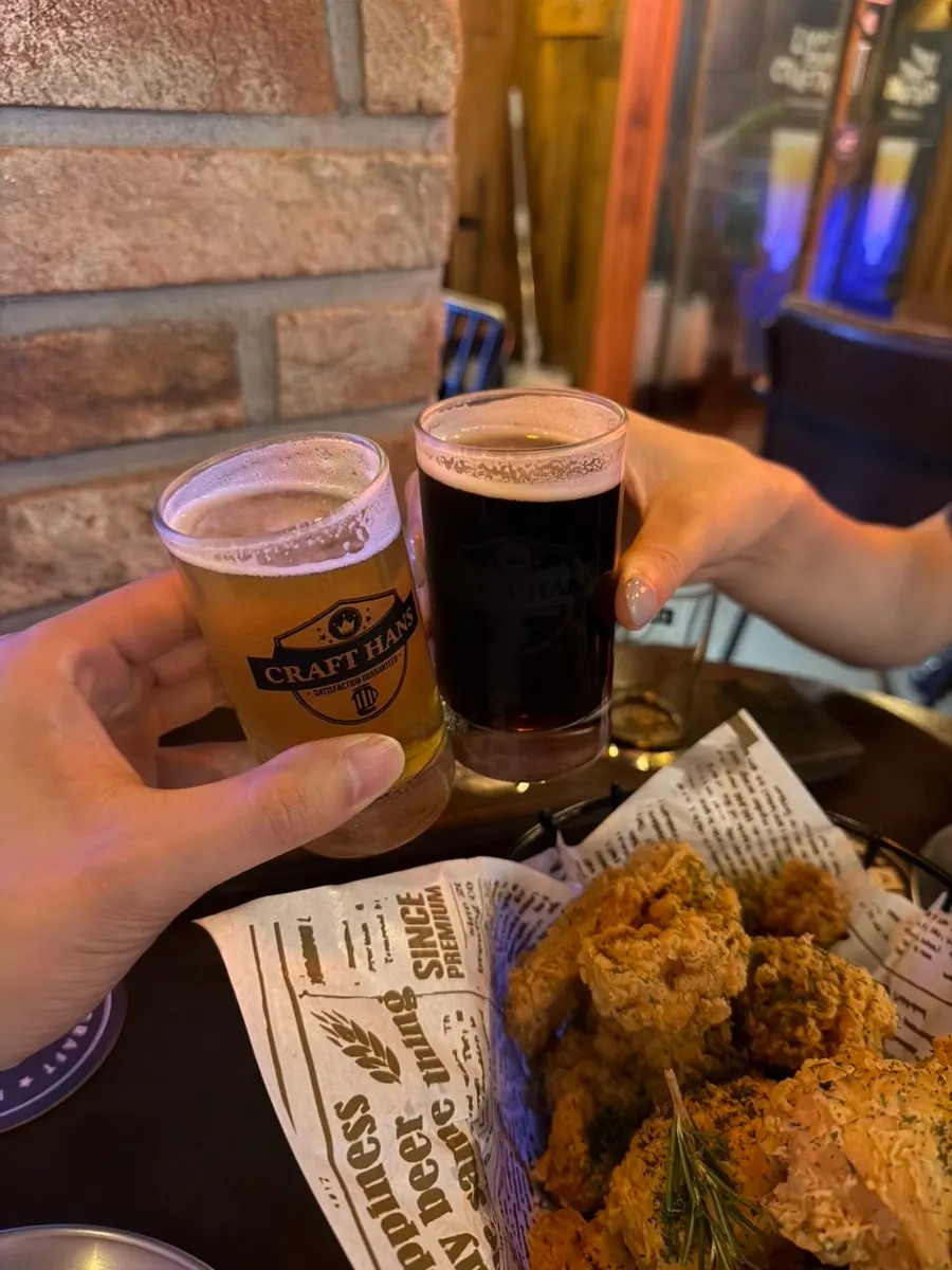 Cheersing with different craft beers in hand