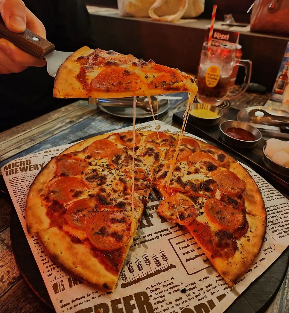 A whole thin-crust pepperoni pizza