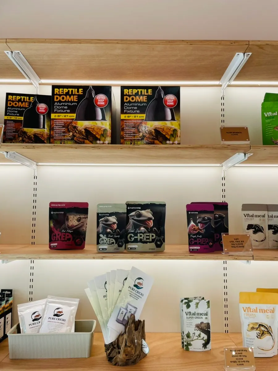 A store shelf organized with reptile husbandry supplies