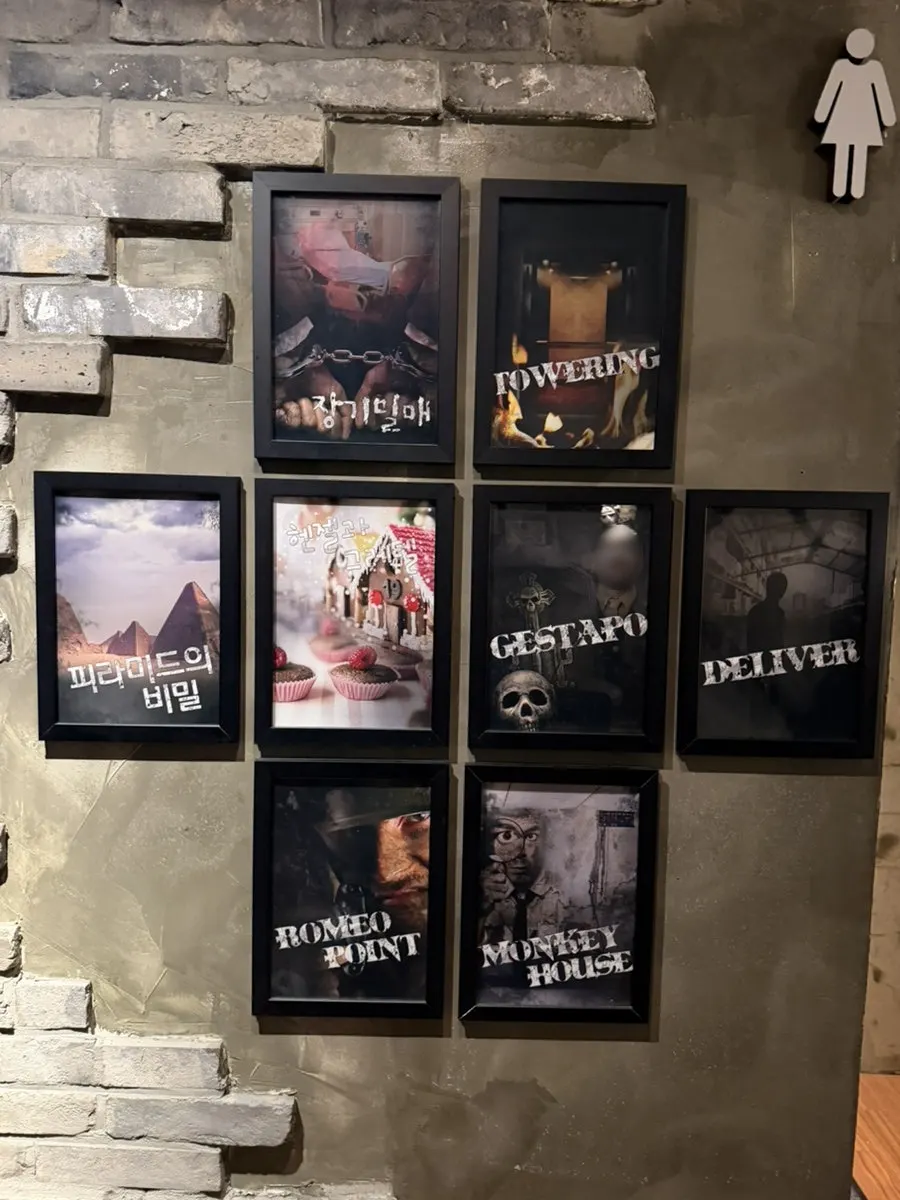Theme list displayed on the wall at Cube Escape Hongdae Branch