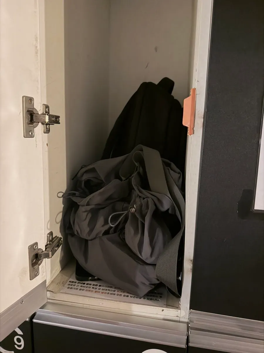 Putting a phone and bag into a locker