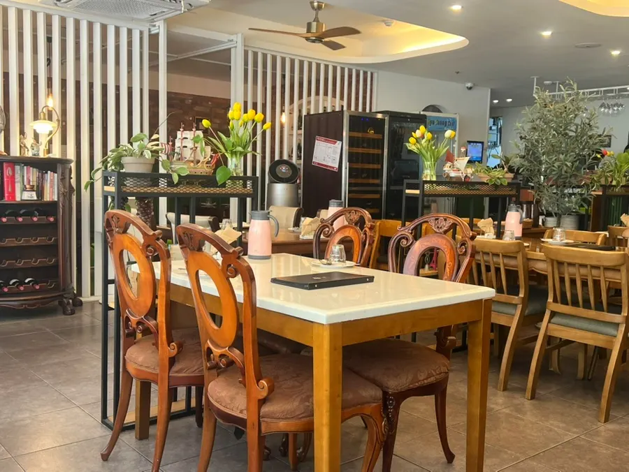 Wine bottles displayed in one corner of Cuisine R