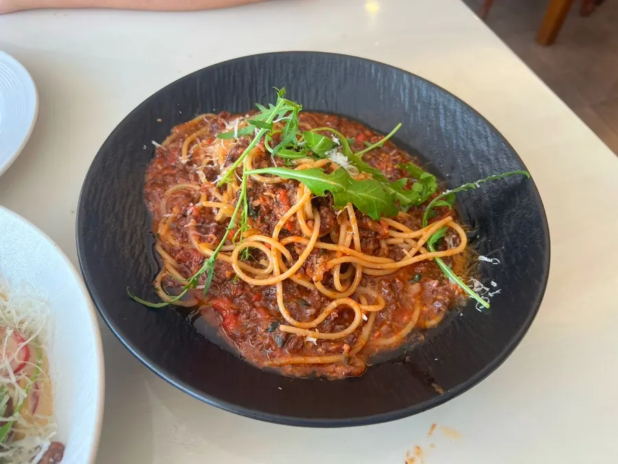 A plate of ragu bolognese pasta at Cuisine R