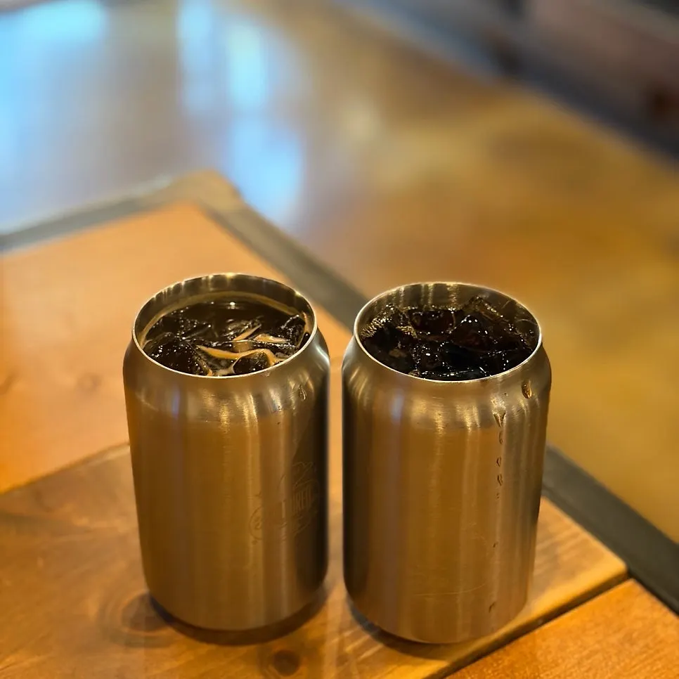 Coffee and cola served in can-shaped cups
