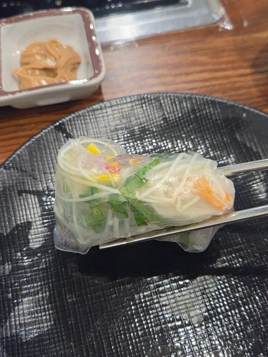 Vietnamese wrap rolled with vegetables and meat
