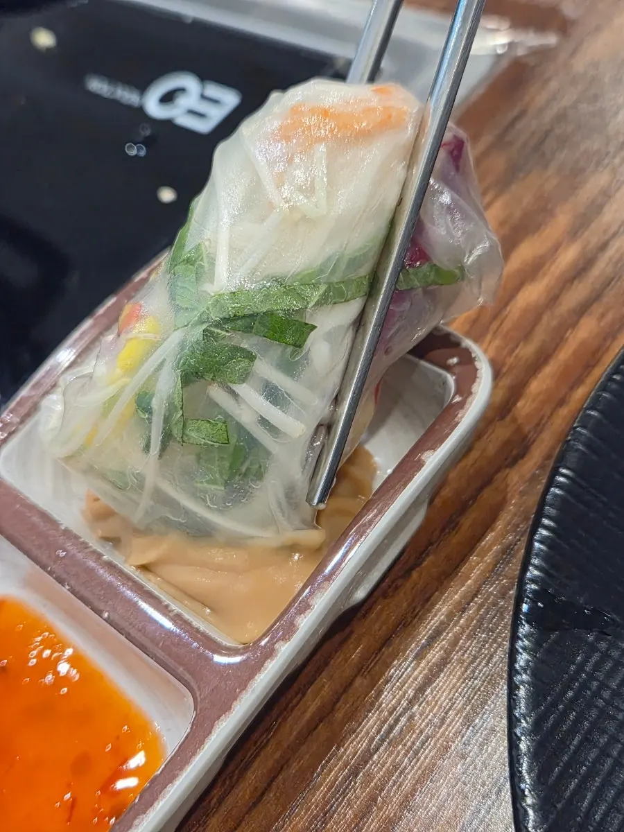 Vietnamese wrap dipped in sauce