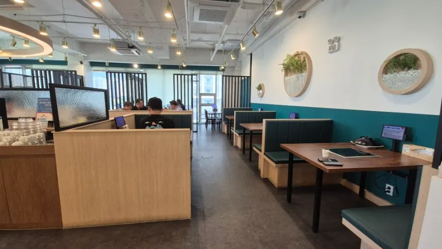 Bright, clean interior of Dadam Shabu Shabu Wirye Branch