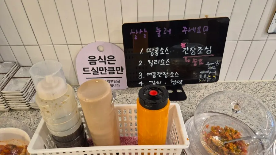 Self-bar with peanut, chili, and spicy soy sauces