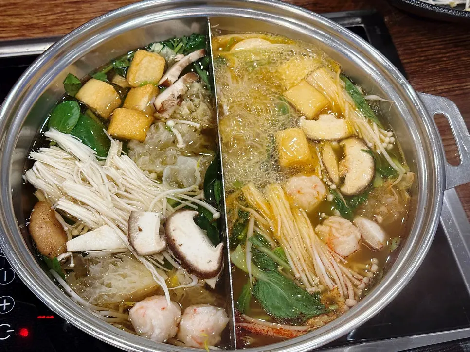 Wrapping shabu-shabu ingredients in wolnamssam rice paper