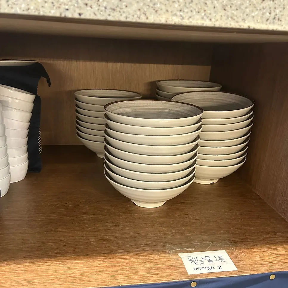 Bowls for shabu-shabu, meat, and wolnamssam set at the table