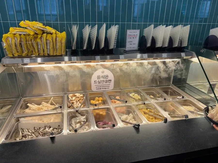 Self-bar with mushrooms, rice cakes, and noodles
