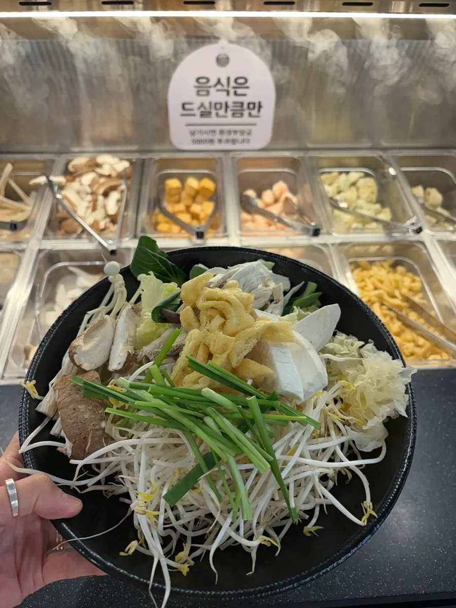 A spread of vegetables and meat gathered from the self-bar