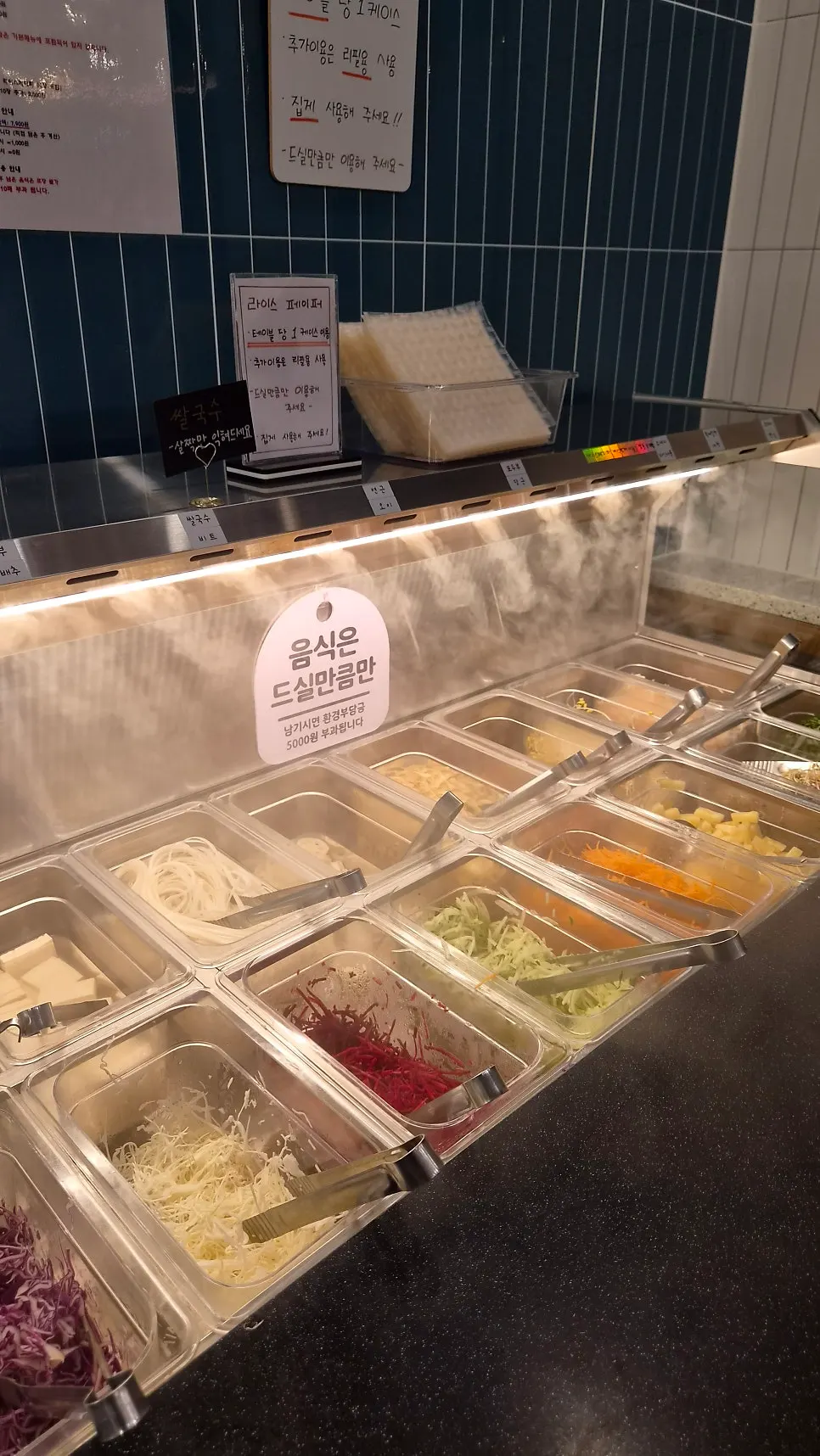 Dumplings, shrimp balls and other side ingredients at the self-bar
