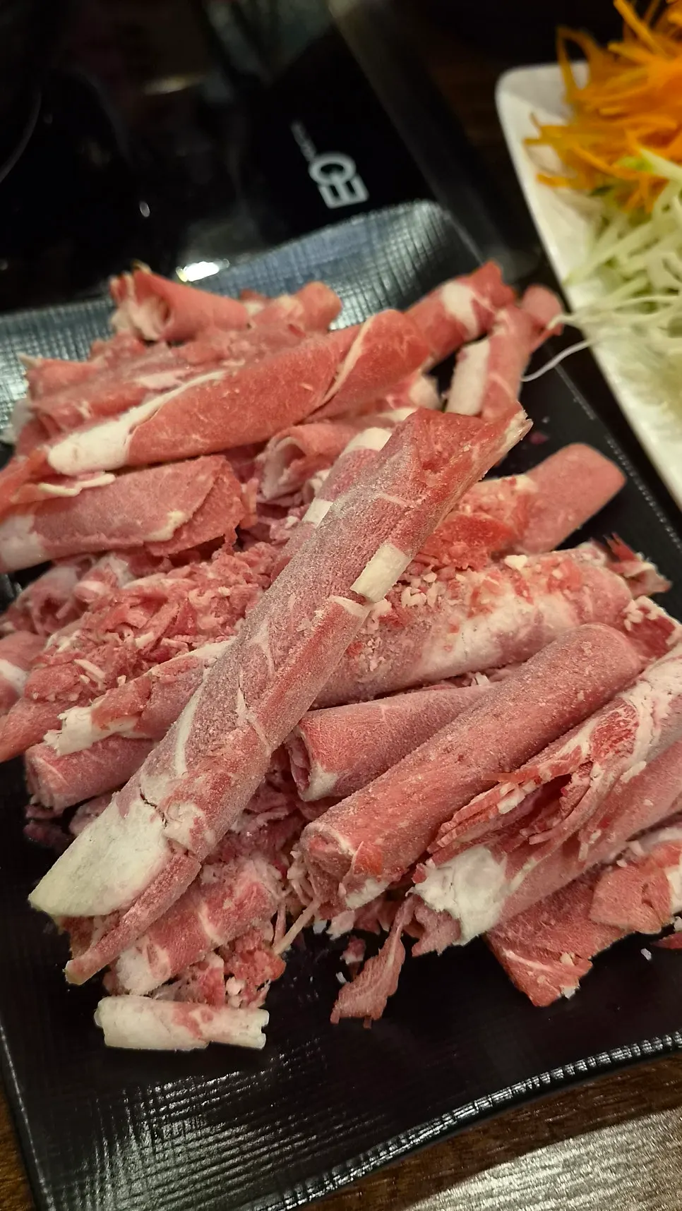 Shabu-shabu simmering with vegetables and meat in the broth