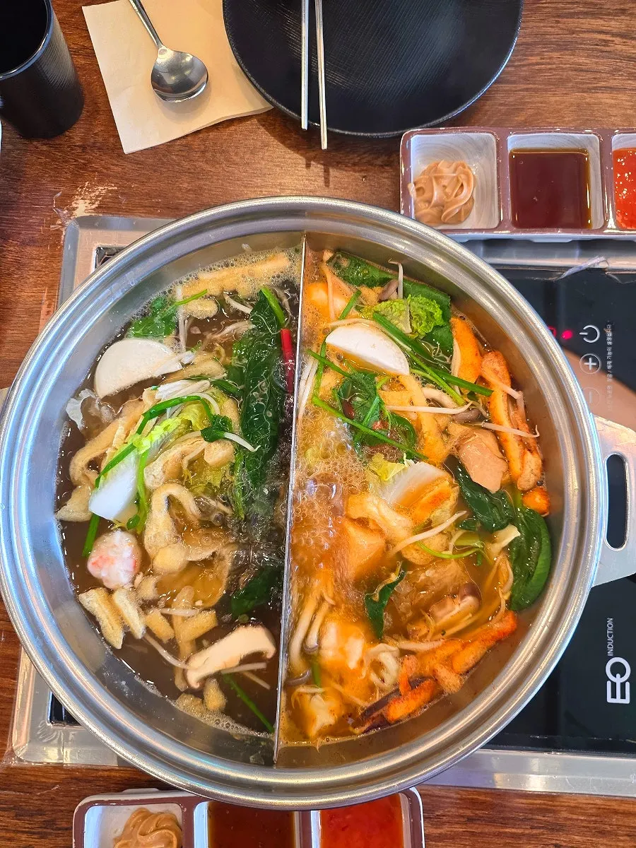 Kalguksu noodles boiled in the spicy broth