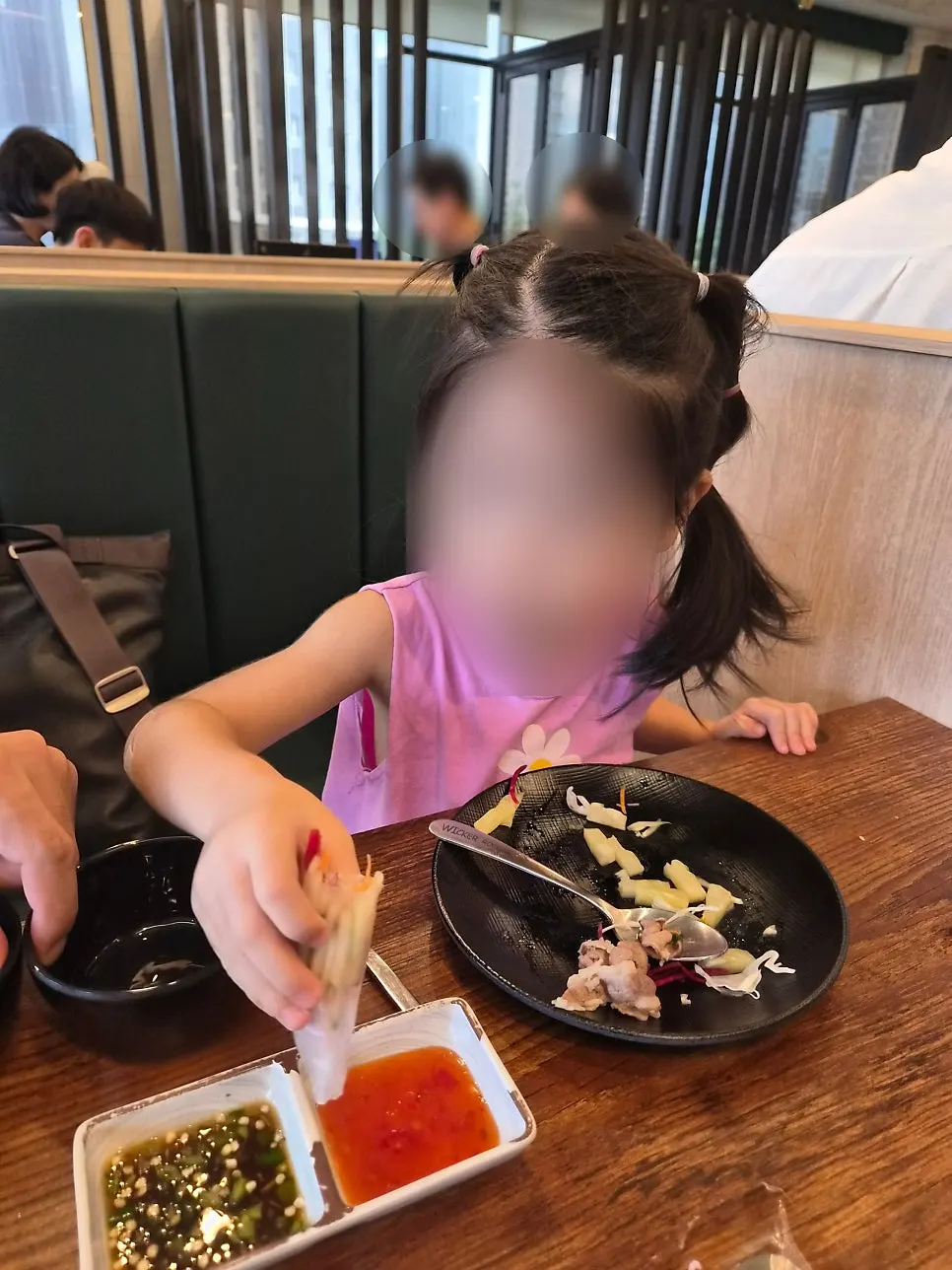 4-year-old eating a wolnamssam wrap