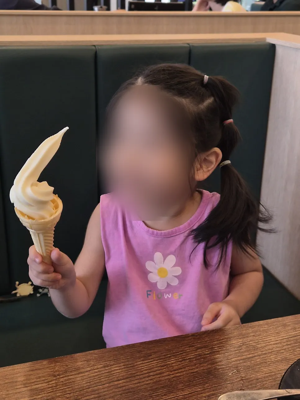 A child receiving dessert ice cream