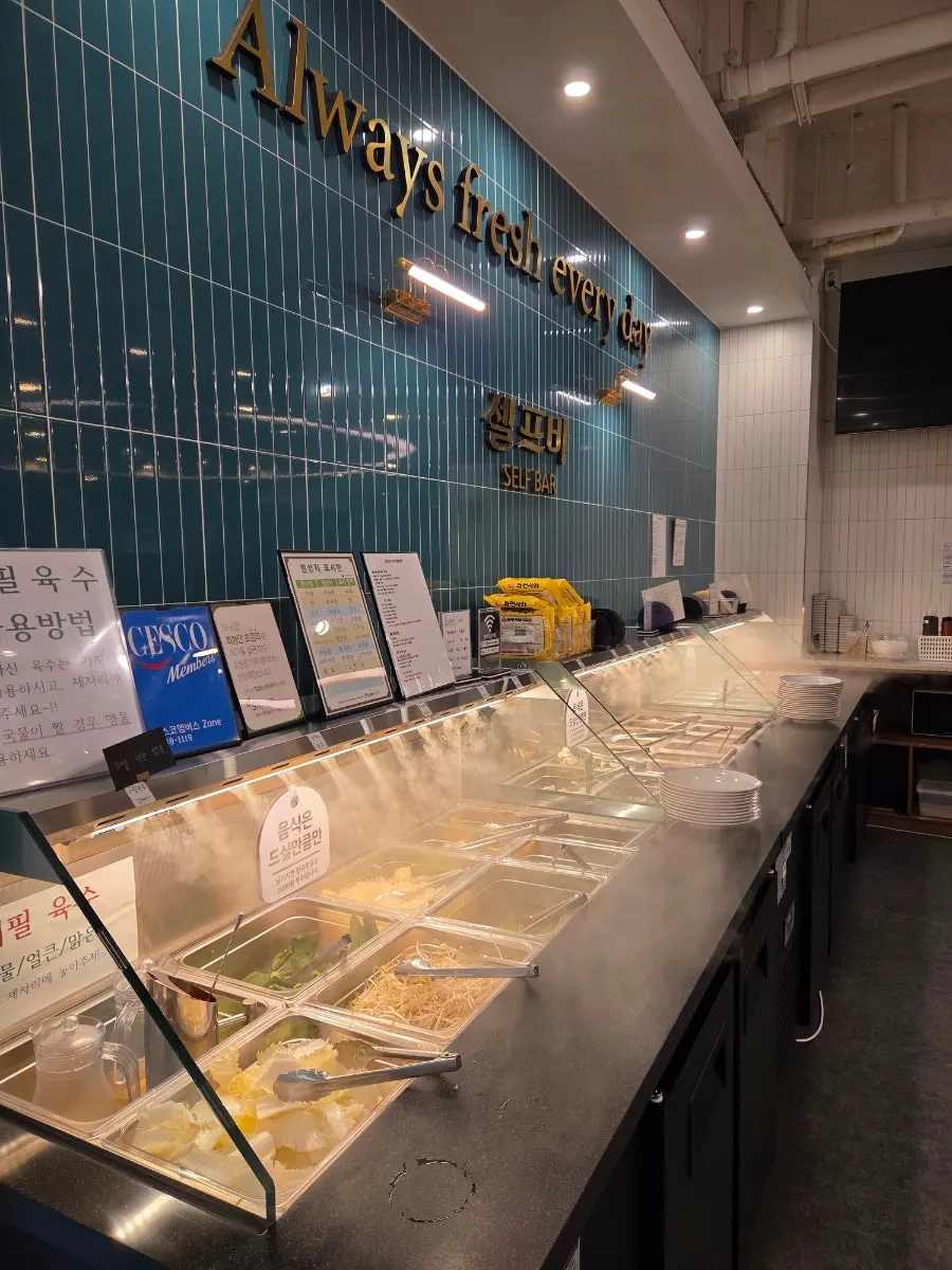 Sign explaining dining time limits and the environmental fee