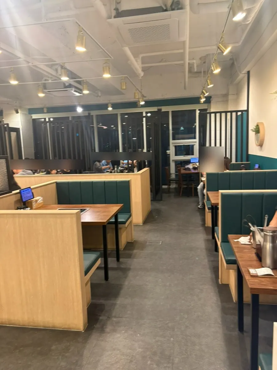Interior of the restaurant with all-you-can-eat pricing signage