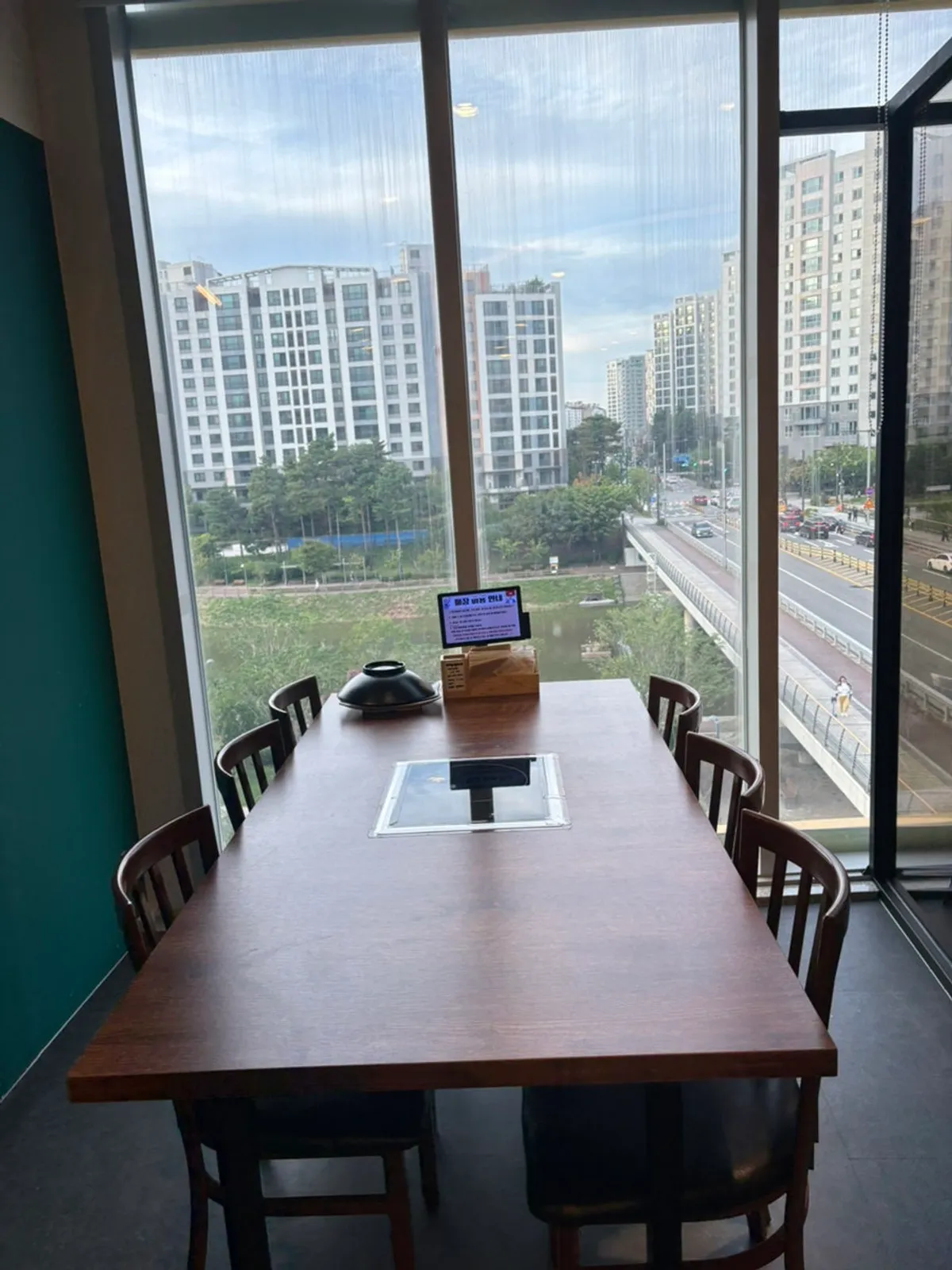 Spacious dining room with window seating at Dadam Shabu Shabu Wirye Branch