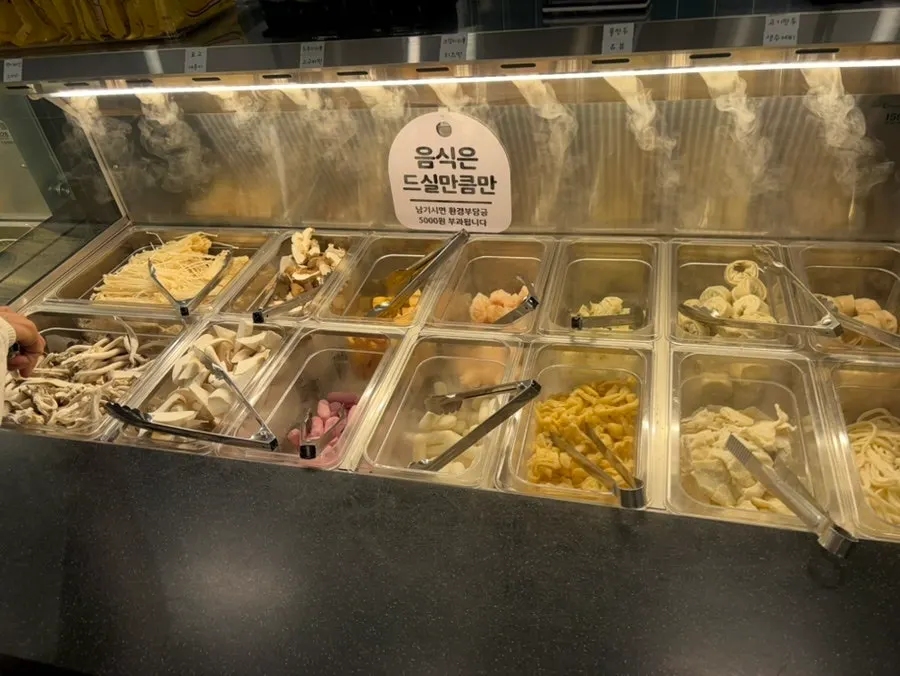 Table with a pot of shabu-shabu broth