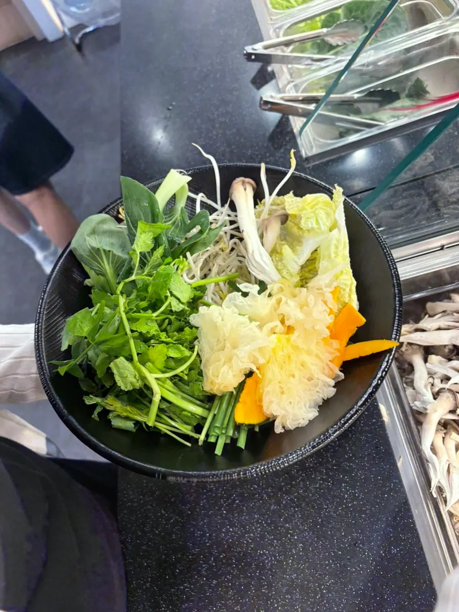 A plate piled high with vegetables and mushrooms