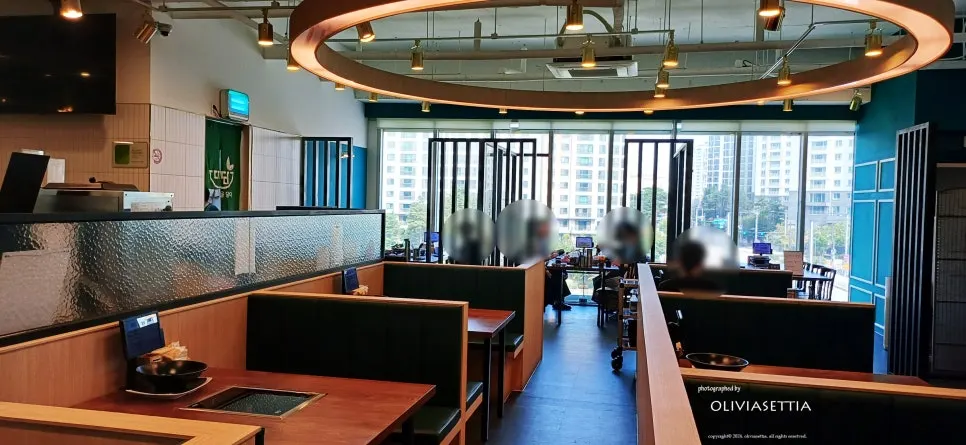 Window seat at Dadam Shabu Shabu Wirye Branch overlooking Changgokcheon Stream