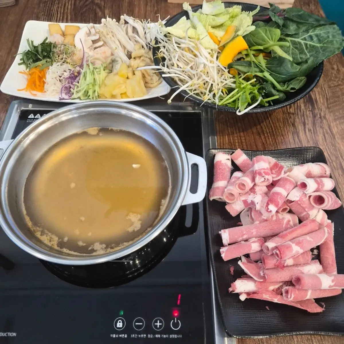Seafood broth simmering in the shabu-shabu pot